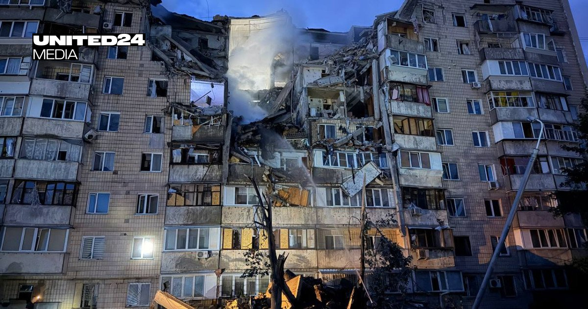 A Russian attack on Kyiv damaged a residential building in the Podilskyi district, trapping people.