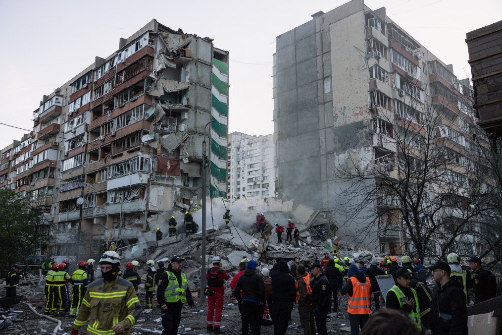Ukrainian emergency services search through the rubble of a partially collapsed building following a Russian missile and drone attack on May 14, 2026, in Kyiv, Ukraine. (Source: Getty Images)