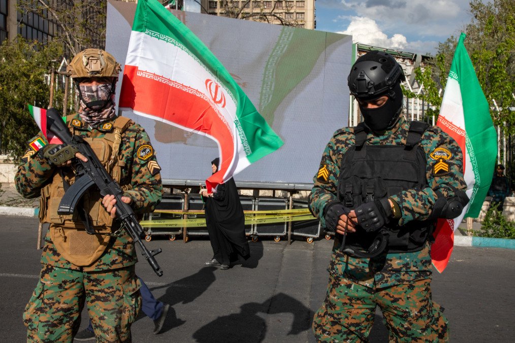 Members of Iran's security forces stand guard during a memorial marking 40 days since a strike in the southern Iranian town of Minab on April 7, 2026, in Tehran, Iran. Illustrative photo. (Source: Getty Images)