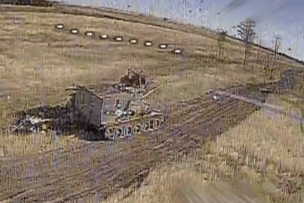 Russian T-54 medium tank with added armor moments before a Ukrainian FPV drone strike, September 2026.