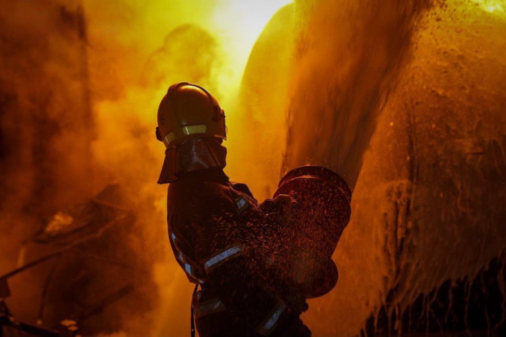 A firefighter works to extinguish a blaze following a Russian attack on Ukraine. Illustrative photo. (Photo: DSNS)