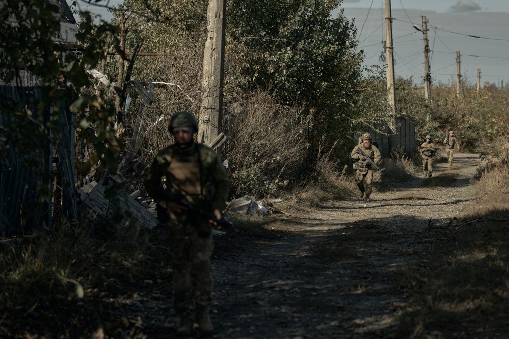 Ukrainian Marines walk through the heavily damaged frontline city of Kostiantynivka in the Donetsk region, October 16, 2025. (Source: Getty Images)