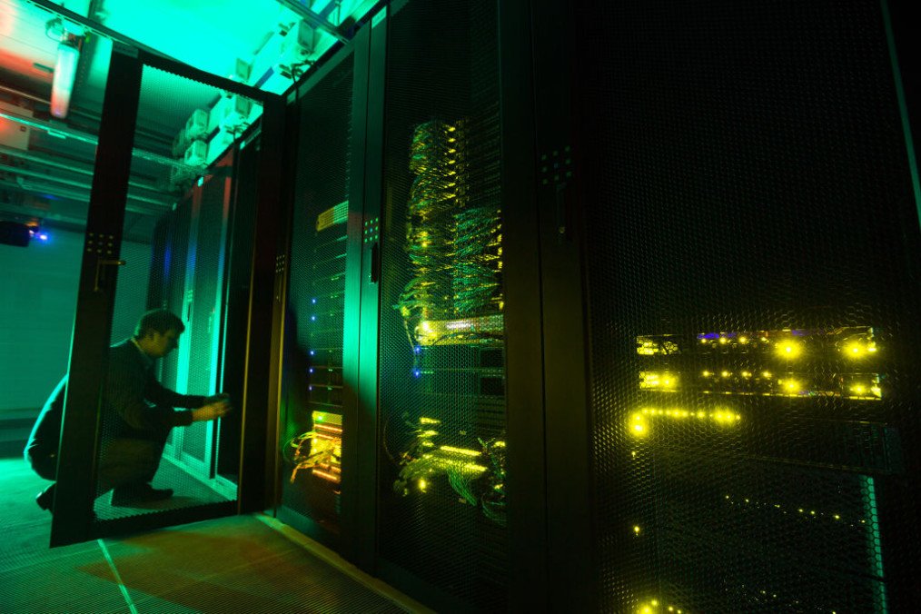 An employee opens a cabinet door of the Sberbank and SberCloud Christofari supercomputer in Moscow, Russia. (Source: Getty Images)
