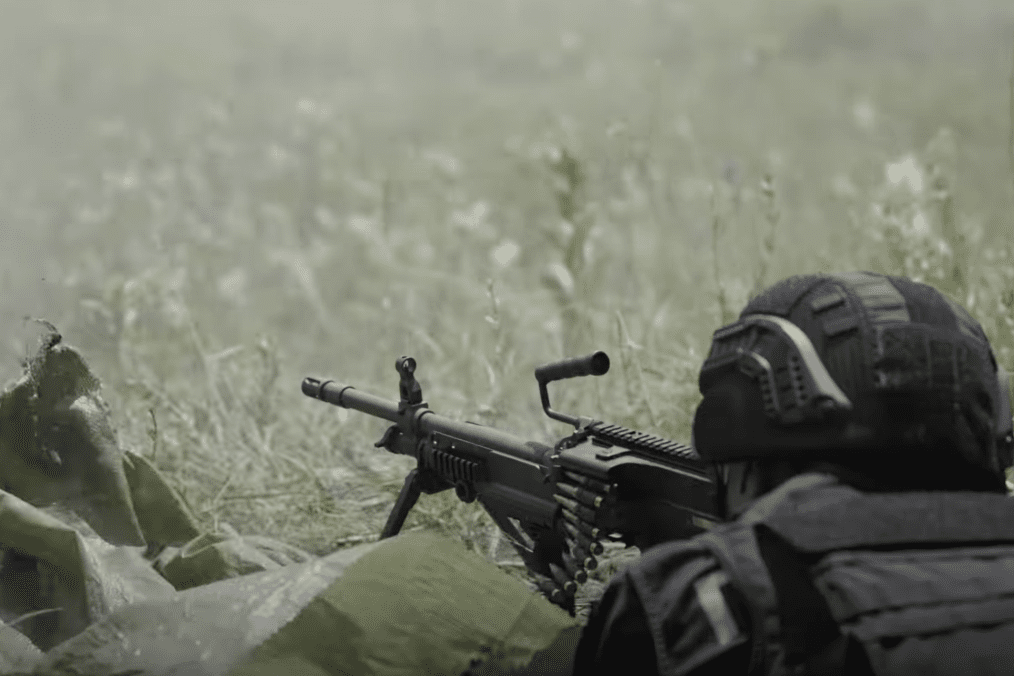 A patrol police officer fires a machine gun during joint training with Ukraine’s Khartiia Brigade in the Kharkiv region. (Source: NV/YouTube) A patrol police officer fires a machine gun during joint training with Ukraine’s Khartiia Brigade in the Kharkiv region. (Source: NV/YouTube)