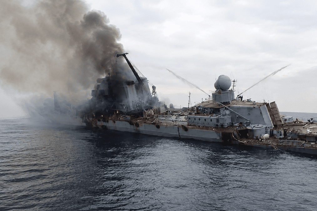 The Russian Black Sea Fleet flagship Moskva burns after being struck by Ukrainian Neptune anti-ship missiles in the Black Sea in April 2022. (Photo: Open source)