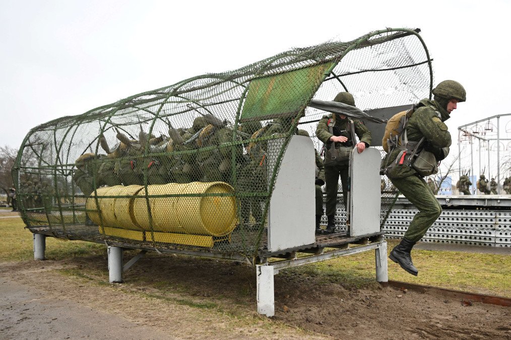 Paratroopers of the 38th Separate Guards Air Assault Brigade of the Armed Forces of Belarus perform a parachute jump training exercise at the brigade’s grounds in Brest on February 13, 2023. Paratroopers of the 38th Separate Guards Air Assault Brigade of the Armed Forces of Belarus perform a parachute jump training exercise at the brigade’s grounds in Brest on February 13, 2023.