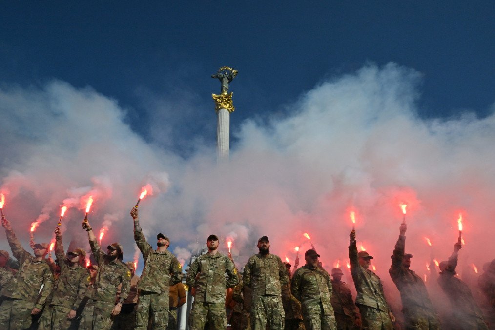 Ukrainian Azov Brigade servicemen hold flares during a memorial event in Kyiv marking the second anniversary of the Olenivka prison attack, July 28, 2024. (Source: Getty Images)