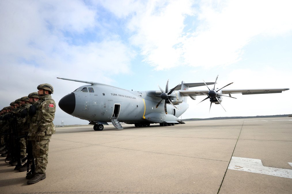 A row of Turkish soldiers stands beside a Turkish Air Force transport aircraft on a runway. (Source: Getty Images) A row of Turkish soldiers stands beside a Turkish Air Force transport aircraft on a runway. (Source: Getty Images)
