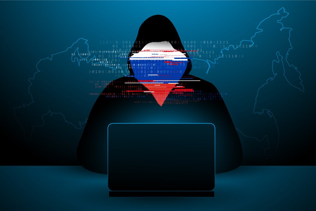 Illustrative image of a hacker wearing a hoodie, with the Russian flag overlayed on the face. (Photo: Getty Images)
