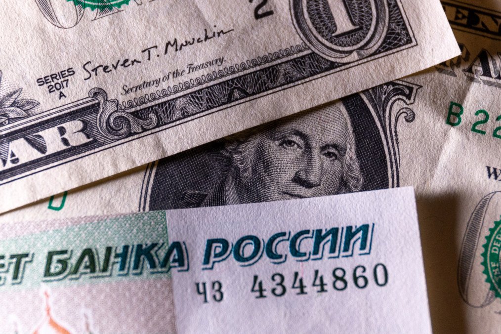Russian rouble notes are seen besides one dollar bill notes on January 11, 2025 in Bath, England. Illustrative photo. (Source: Getty Images)