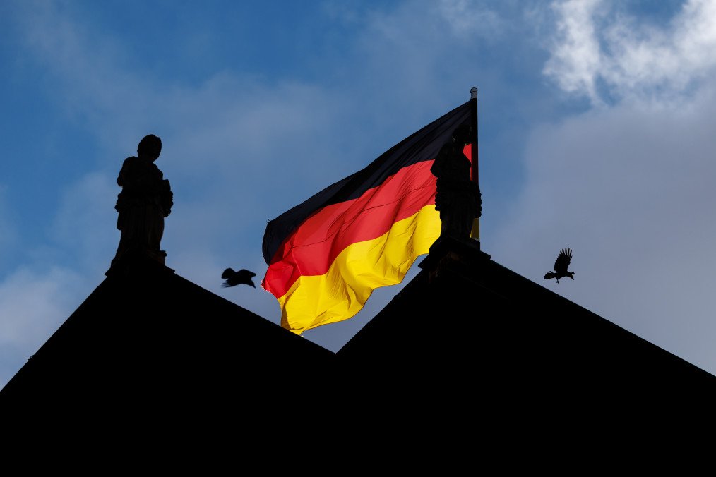 A German flag flies in the wind behind the Victorians, terracotta figures from the Nymphenburg Porcelain Manufactory, on the roof of the Maximilianeum, seat of the Bavarian State Parliament, in Munich. (Source: Getty Images) A German flag flies in the wind behind the Victorians, terracotta figures from the Nymphenburg Porcelain Manufactory, on the roof of the Maximilianeum, seat of the Bavarian State Parliament, in Munich. (Source: Getty Images)