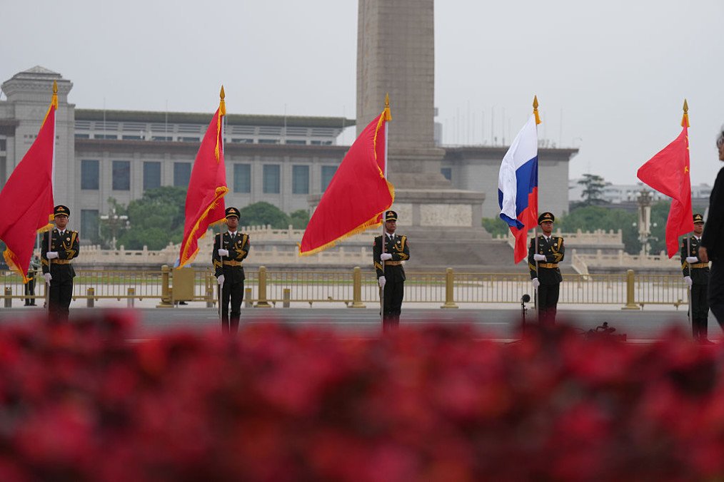 Chinese honor guards hold national flags of China and Russia to welcome Russian leader Vladimir Putin on May 20, 2026 in Beijing, China. (Source: Getty Images)