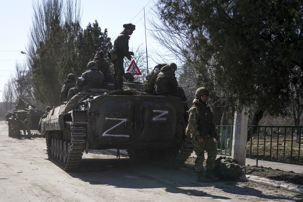 Russian troops and armored vehicle marked with “Z” in Mariupol, March 24, 2022. (Source: Getty Images)