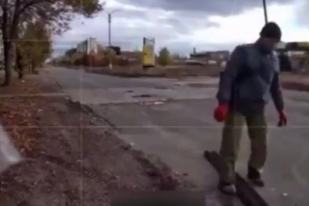 A Ukrainian biker helps to fix a track on a Ukrainian ground robot, October 17, 2025. (Source: Army TV) A Ukrainian biker helps to fix a track on a Ukrainian ground robot, October 17, 2025. (Source: Army TV)