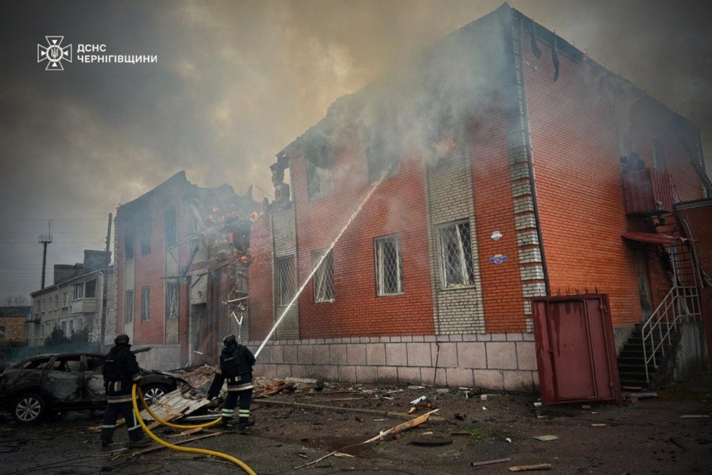 Firefighters work to extinguish flames at a heavily damaged building following a drone strike in Chernihiv region. (Source: State Emergency Service of Ukraine)