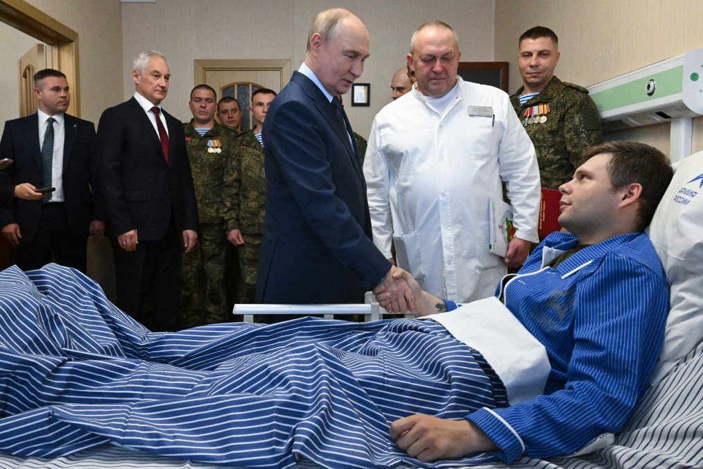 Russian leader Vladimir Putin visits servicemen who were wounded during the Russian military action in Ukraine, at a military hospital in Moscow on October 29, 2025. (Source: Getty Images)