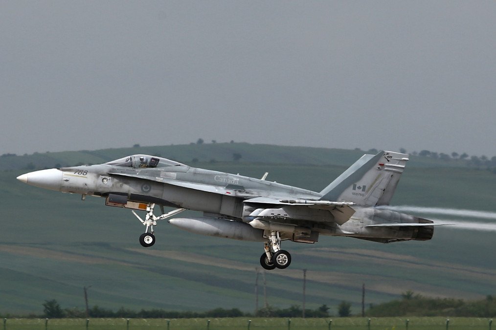 A fighter type F-18 Hornet of Canadian Royal Air Force takes off from the military airbase at Campia Turzii, on May 28, 2014. Illustrative photo. (Source: Getty Images)