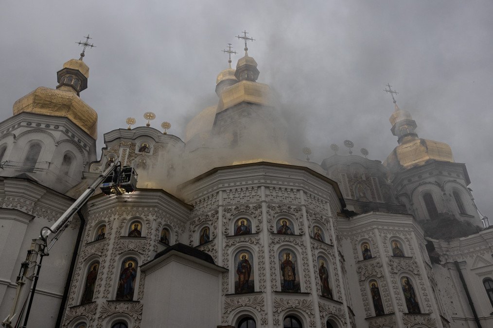Firefighters inspect damage to the Assumption Cathedral at Kyiv Pechersk Lavra following a Russian drone and missile attack on Kyiv, June 15, 2026. (Source: Getty Images)