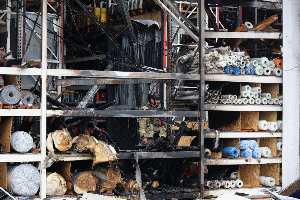 A rescuer works at an Epicenter hypermarket in the Osnovianskyi district, destroyed by a Russian drone attack, in Kharkiv, Ukraine, on August 27, 2026. (Source: Getty Images)