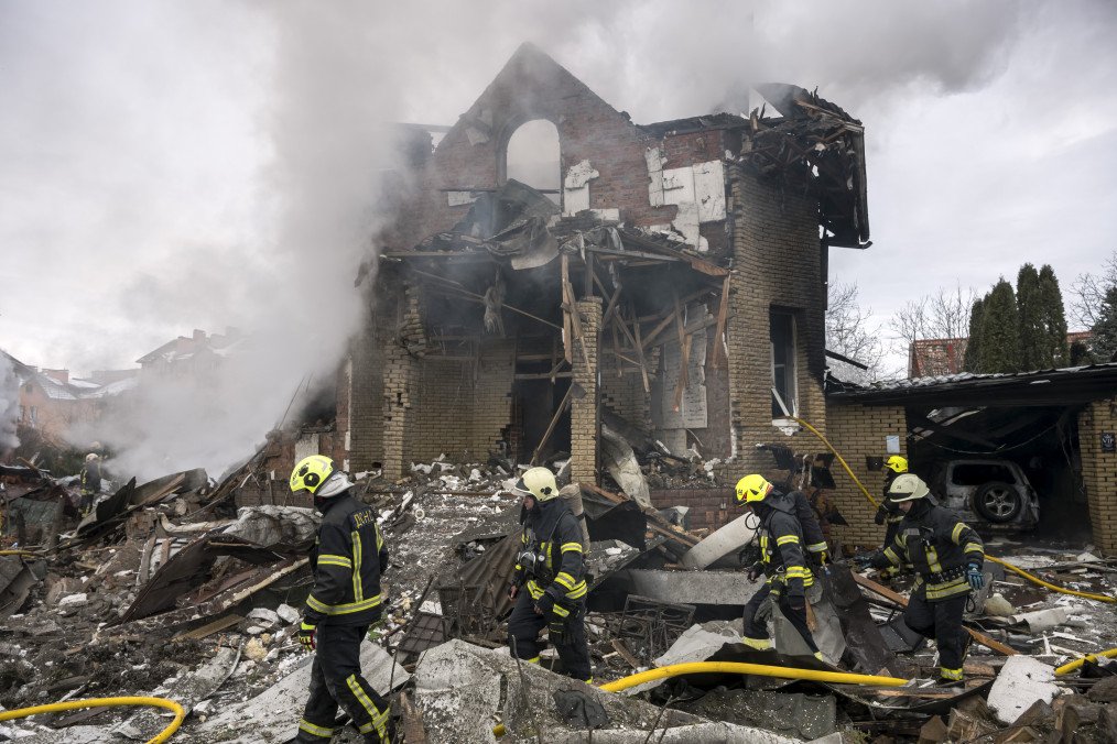 Firefighters work at the site of residential buildings damaged by Russian drone and missile strikes during a mass attack on Ukraine's critical infrastructure in Kyiv, Ukraine. (Source: Getty Images)