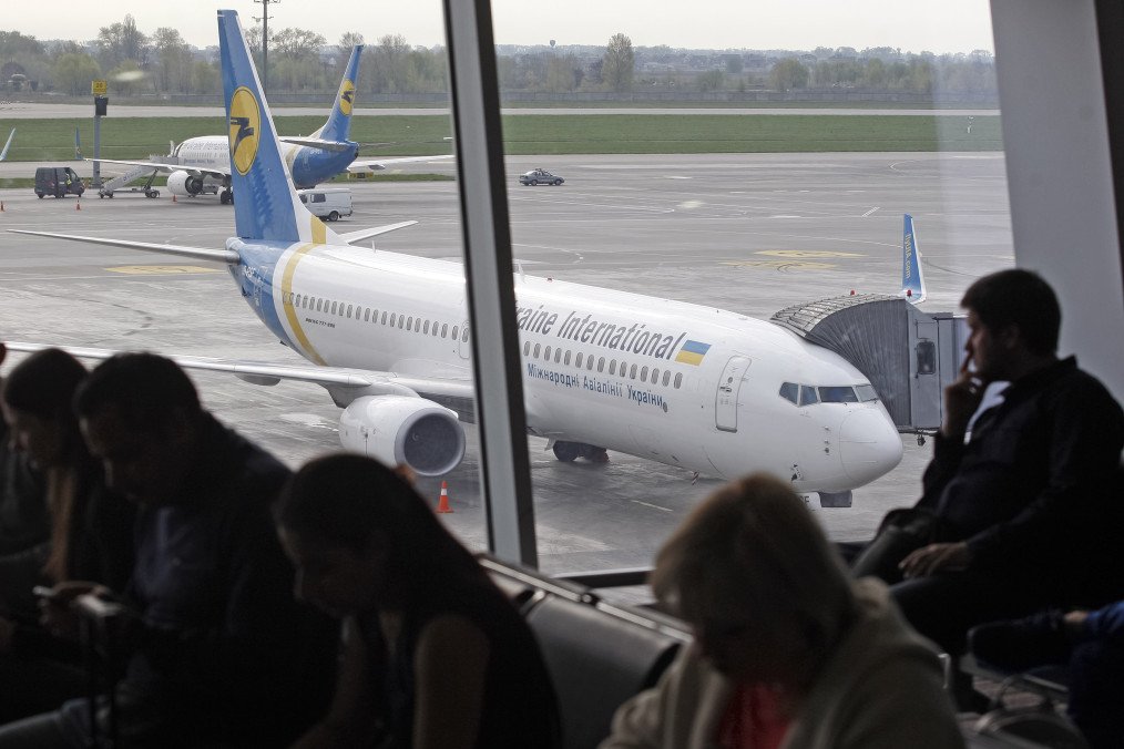 Passengers wait in the premises of the Boryspil International airport. (Source: Getty Images)