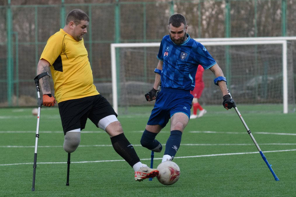 Amputee war veterans of FC Pokrova Lviv AMP (in blue) and League of Mighty combined amputee football team play a friendly football match at the Lviv stadium on March 8, 2025 in Lviv, Ukraine. (Source: Getty Images)