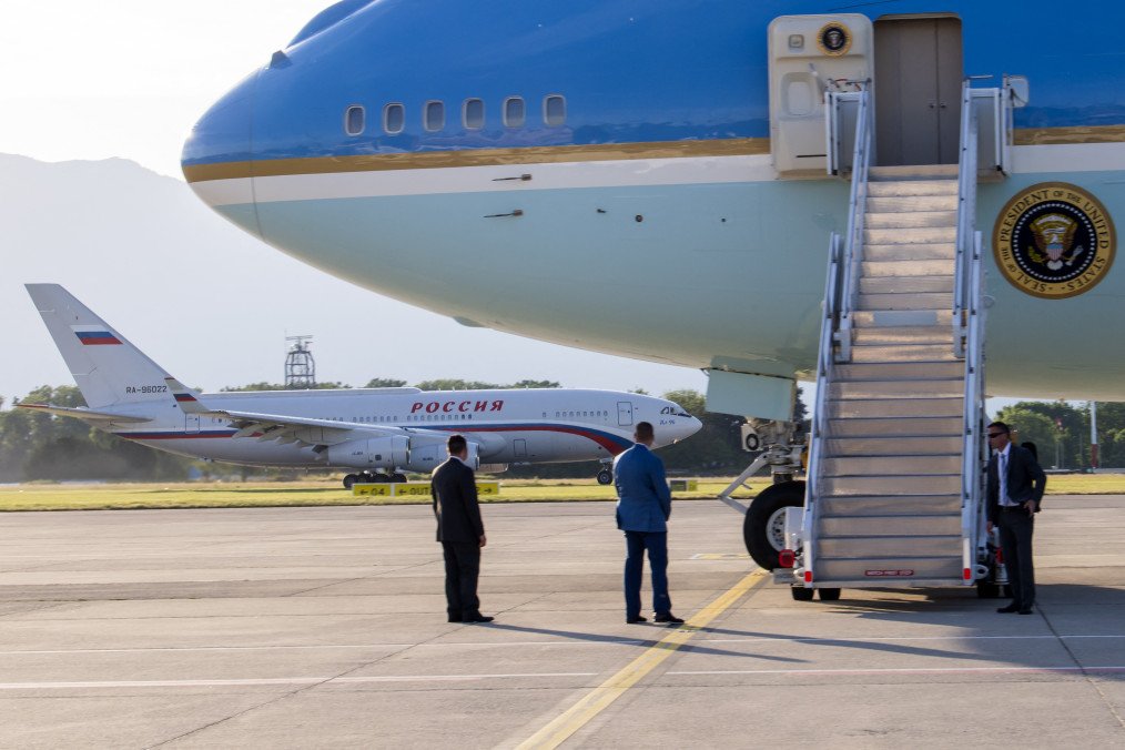 Air Force One, the Boeing-747 airplane of the US President, bottom, stands by, as the Russian Il-96 taxies to the runway, after the US – Russia summit at Geneva Airport Cointrin, on June 16, 2021. (Source: Getty Images)