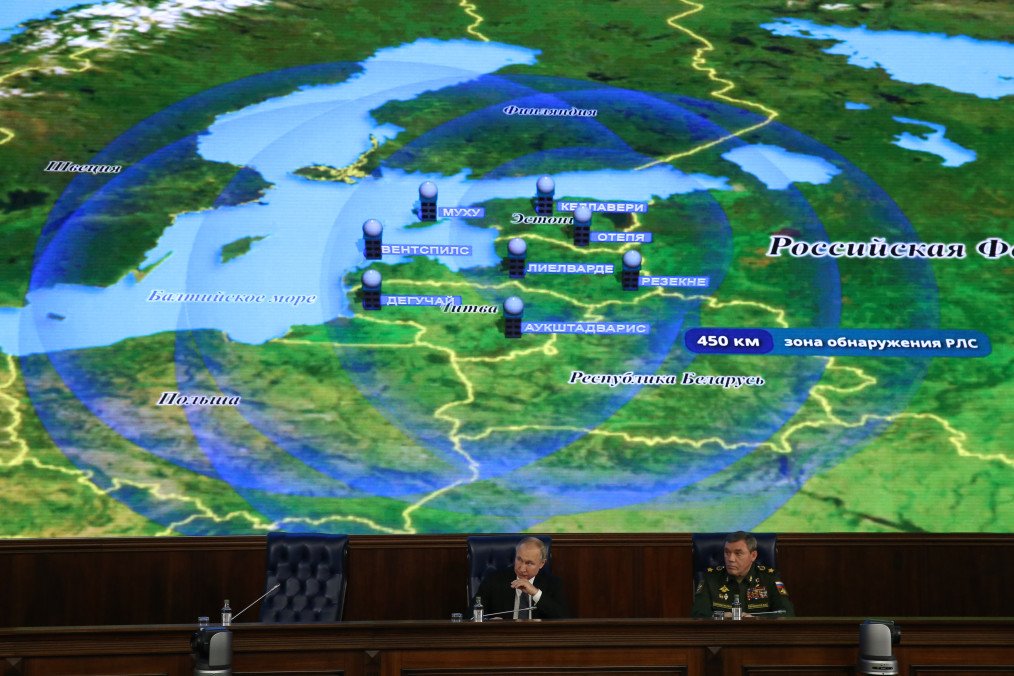 Russian leader Vladimir Putin watches a clip with a map of the Baltic states during the annual meeting of the Extended Board of the Ministry of Defense in Moscow, Russia, on December 24, 2019.