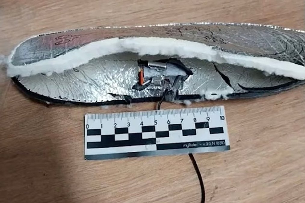 Cutaway view of a modified boot insole showing concealed wiring and internal components. (Source: Daily Mail)