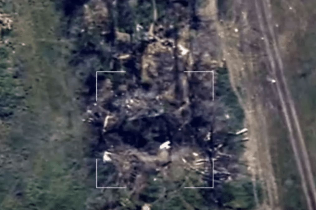 An aerial view from an observation drone captures an incoming strike drone in mid-flight diving directly toward a Russian artillery position along a treeline. (Source: 44th Separate Artillery Brigade) An aerial view from an observation drone captures an incoming strike drone in mid-flight diving directly toward a Russian artillery position along a treeline. (Source: 44th Separate Artillery Brigade)