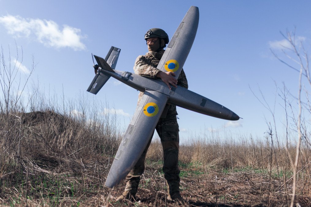 Ukrainian soldier from the “Taifun” UAV unit holds a ‘Marsianin’ attack drone in Kharkiv region, Ukraine, April 7, 2026. (Source: Getty Images)
