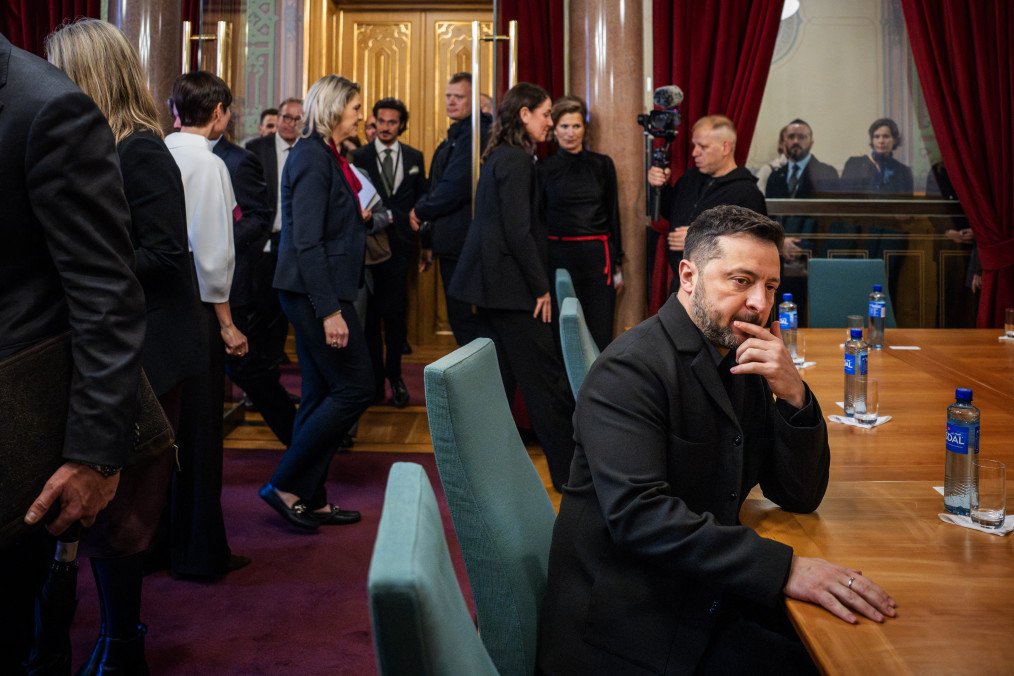 Ukraine’s President Volodymyr Zelenskyy sits at a table before a meeting with the President of Norway’s Parliament at the Storting on October 21, 2026.