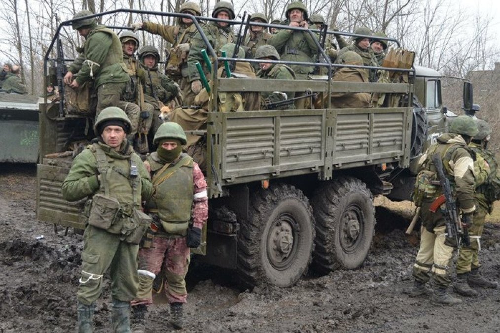 Russian servicemen gather near a military transport truck in an undisclosed location during Russia’s war against Ukraine. (Photo: Open source)