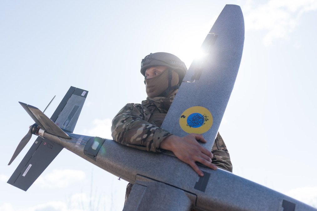 A portrait of a soldier from the “Taifun” unmanned aerial vehicle unit holding a new model “Marsianin” attack drone on April 7, 2026, in the Kharkiv region, Ukraine. (Source: Getty Images)