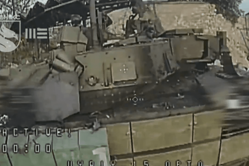 Russian T-72B3A tank fitted with the Arena-M active protection system moments before a Ukrainian FPV-drone hit, July 2026.
