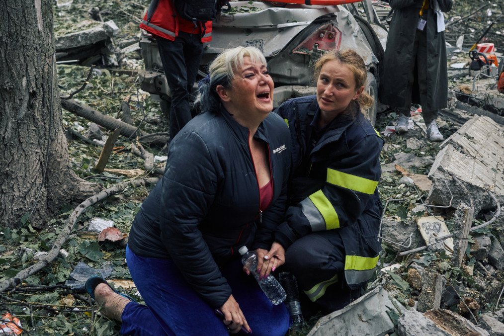 Woman crying after son rescue