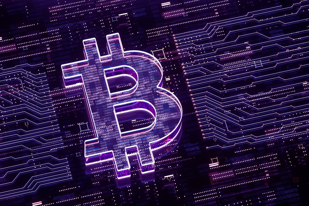 Digital generated image of bitcoin sign over glowing digital circuit board. Illustrative photo. (Source: Getty Images)