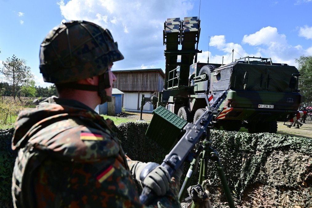 A soldier from Homeland Security Regiment 3 stands near a Patriot anti-aircraft missile system during the “National Guardian” exercise at the tank training school on the Munster military training area, April 18, 2024, Lower Saxony. (Source: Getty Images)