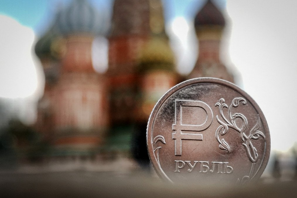 A Russian ruble coin pictured against St. Basil's Cathedral amid economic slowdown, September 2025. (Source: Getty Images)
