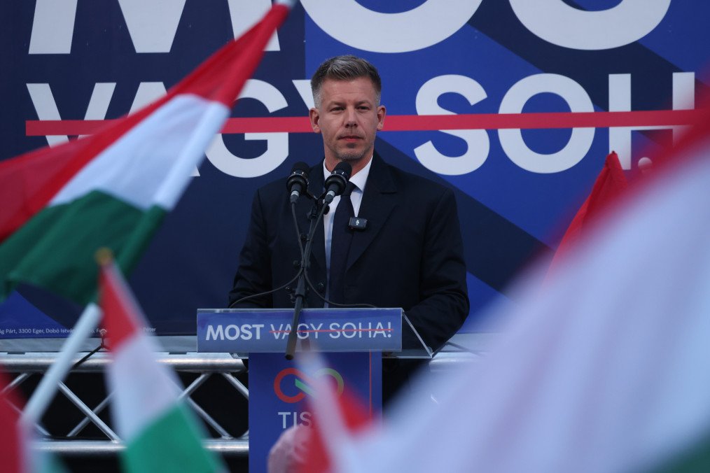 People wave Hungarian flags as Peter Magyar speaks at his final election campaign rally before tomorrow's Hungarian parliamentary elections on April 11, 2026 in Debrecen, Hungary. (Source: Getty Images)