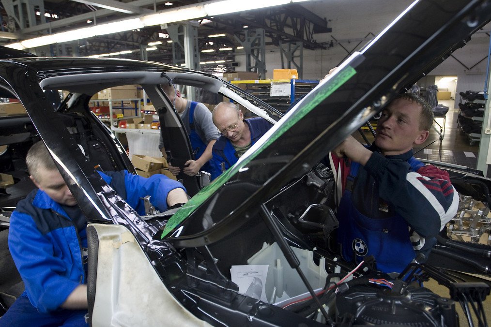 Workers assemble a BMW 5-series at the Avtotor automobile plant in Kaliningrad, Russia, on November 28, 2008.