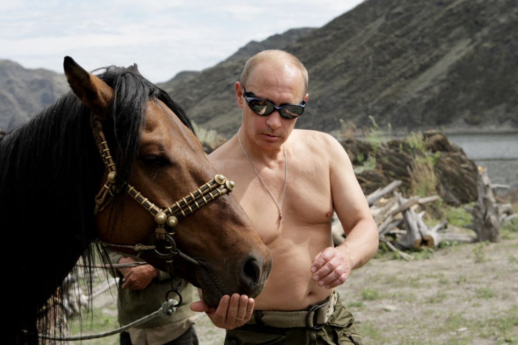 Then-Prime Minister of Russia Vladimir Putin pictured with a horse during a vacation outside the town of Kyzyl in southern Siberia. (Source: Getty Images)