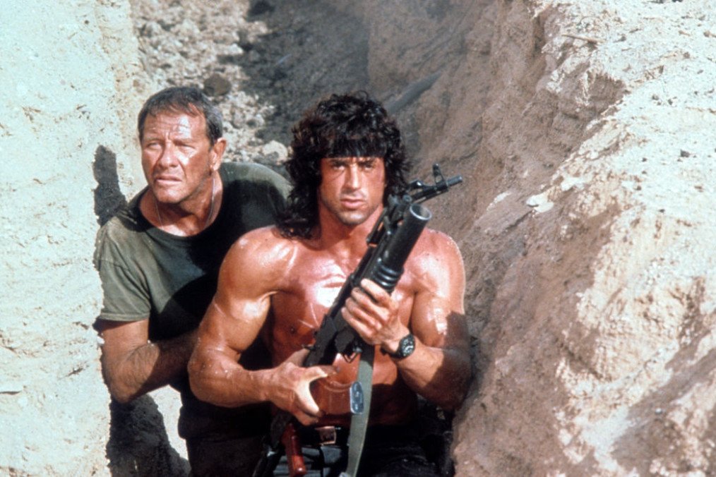 Sylvester Stallone walks through a trench with Richard Crenna in a scene from the film 'Rambo III', 1988. (Source: Getty Images) Sylvester Stallone walks through a trench with Richard Crenna in a scene from the film 'Rambo III', 1988. (Source: Getty Images)