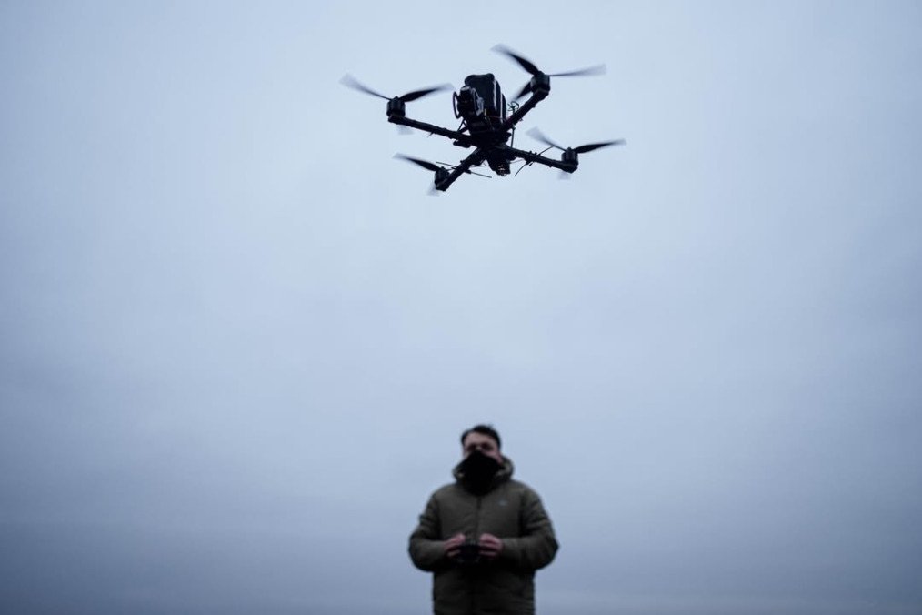 A drone operator controls the flight of a drone against a cloudy sky, showcasing the precision and technology behind modern UAV systems. (Photo: General Chereshnya)
