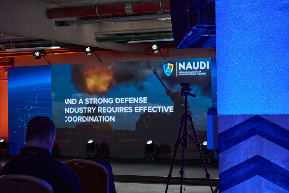 A screen at the “Defense 2027. Army, Technology, Industry” forum in Kyiv highlights the role of coordination in Ukraine’s defense industry. (Source: Mykyta Shandyba/UNITED24 Media)