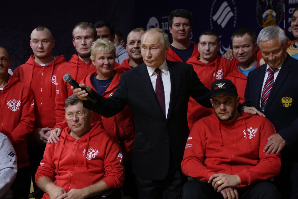 Russian leader Vladimir Putin poses for a group photo with Paralympic athletes who became disabled due to their participation in the war against Ukraine, October 17, 2024, in Ufa, Russia. (Source: Getty Images)