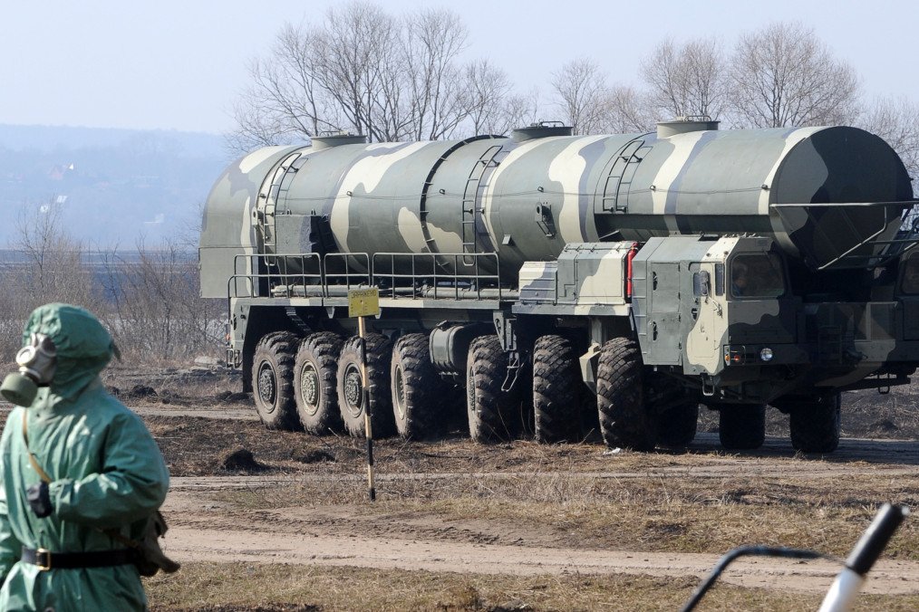 Russian soldier wearing a chemical protection suit next to a military fueler on the base of a prime mover of a Russian Topol intercontinental ballistic missile, some 100km outside Moscow on April 6, 2010. Russian soldier wearing a chemical protection suit next to a military fueler on the base of a prime mover of a Russian Topol intercontinental ballistic missile, some 100km outside Moscow on April 6, 2010.