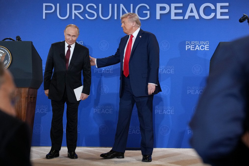 US President Donald Trump and Russian leader Vladimir Putin leave following a press conference at Joint Base Elmendorf-Richardson on August 15, 2025, in Anchorage, Alaska. (Source: Getty Images)