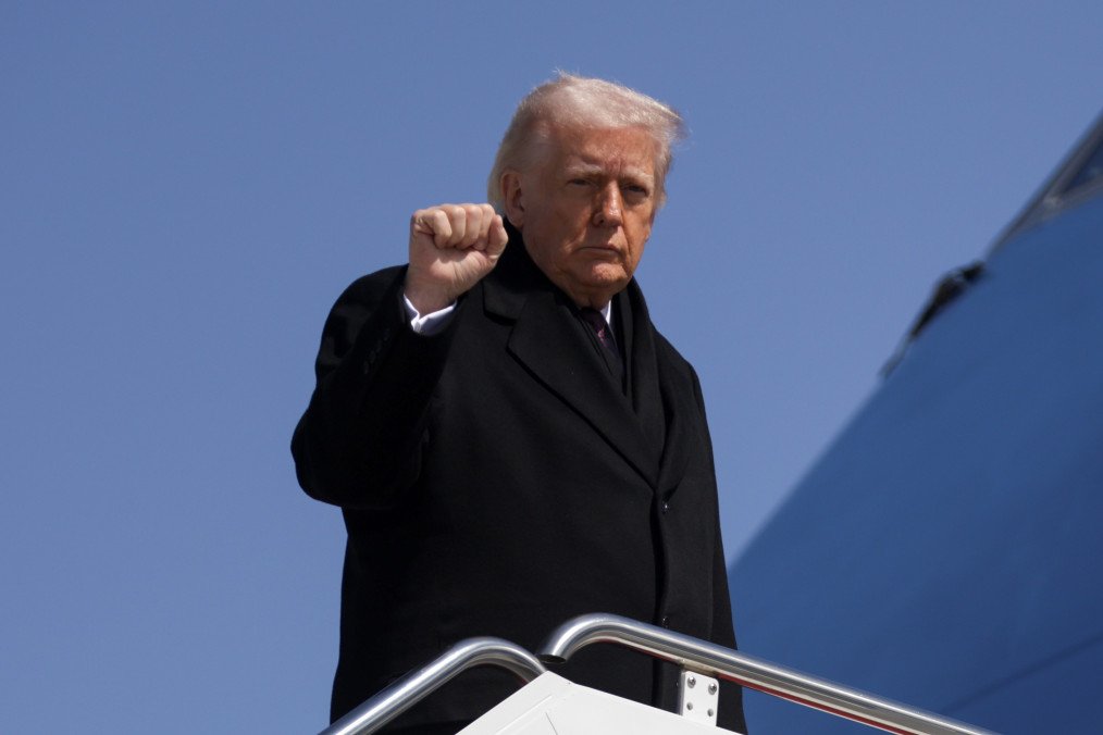US President Donald Trump raises his fist while boarding Air Force One at Joint Base Andrews, Maryland. (Source: Getty Images) US President Donald Trump raises his fist while boarding Air Force One at Joint Base Andrews, Maryland. (Source: Getty Images)