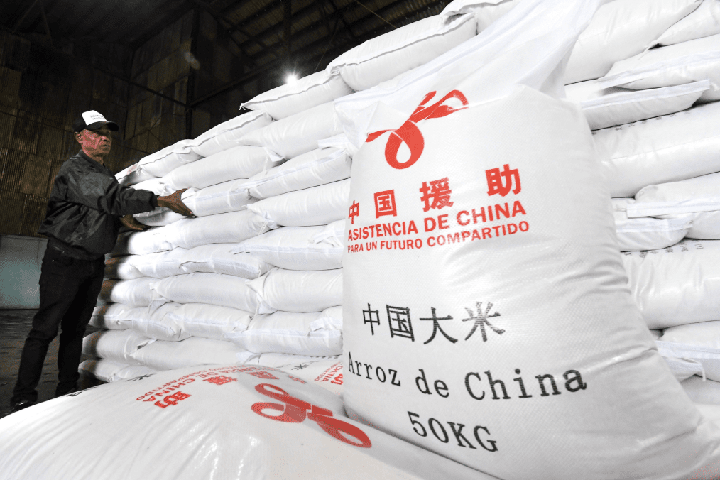 Bags of rice marked “Assistance from China” are stacked at a warehouse in China. (Source: South China Morning Post) Bags of rice marked “Assistance from China” are stacked at a warehouse in China. (Source: South China Morning Post)